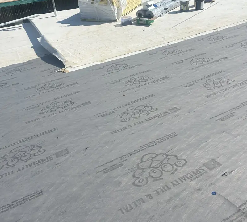 Low-slope roof base sheet being installed by Epoch Roofing (work in progress)