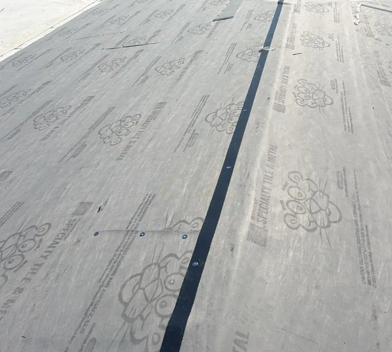 Low-slope roof base sheet being installed by Epoch Roofing (work in progress)